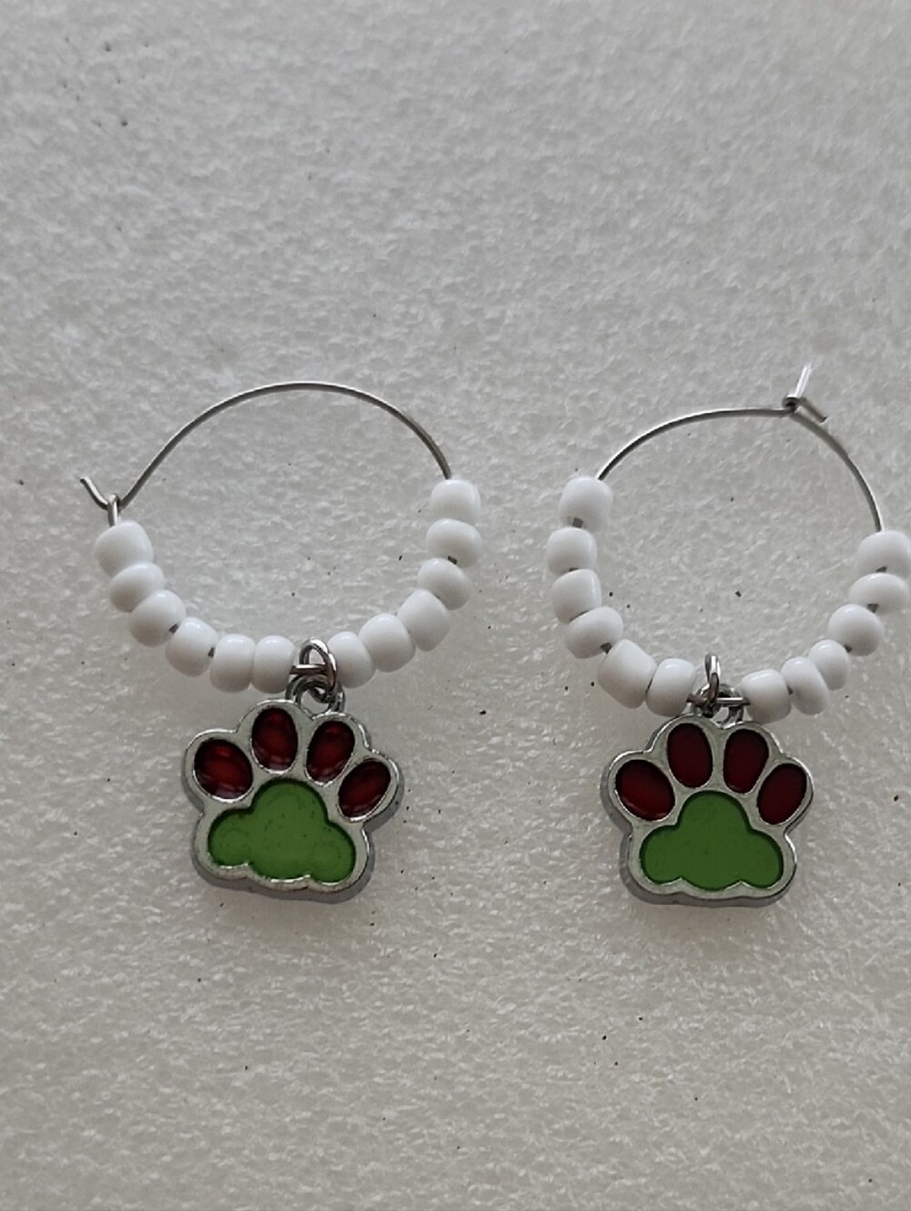 Hand Crafted White Beaded Hoop Earrings with Green and Red Paw Charms